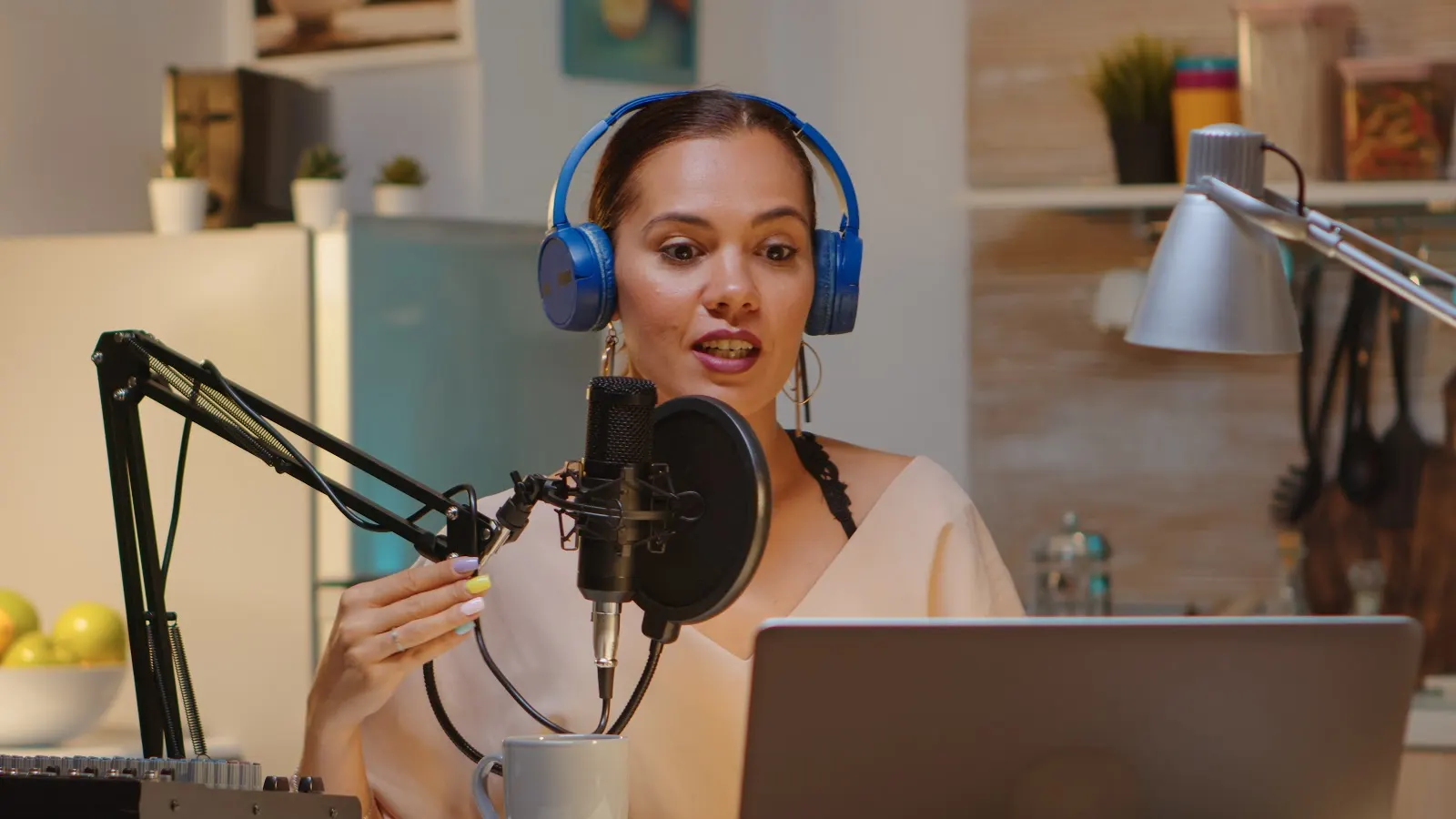 Girl with headphones recording a podcast